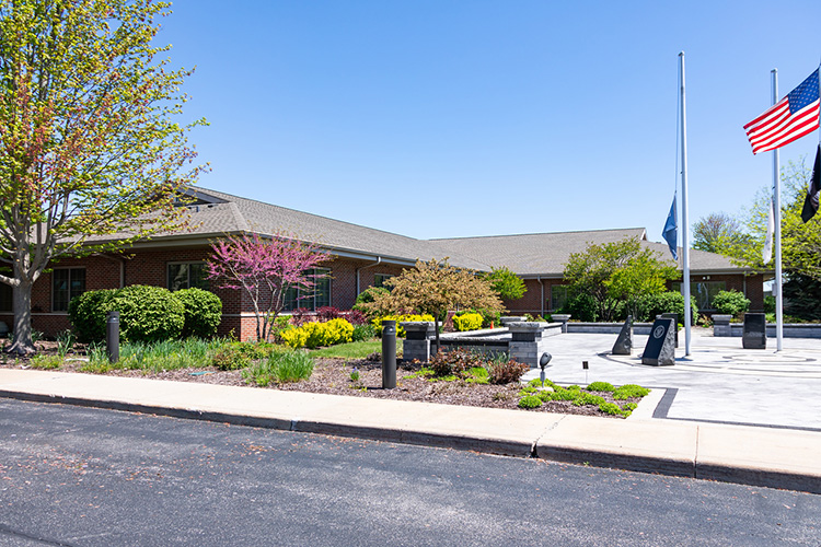 Lightways Joliet outdoor photo of veterans memorial garden and buidling