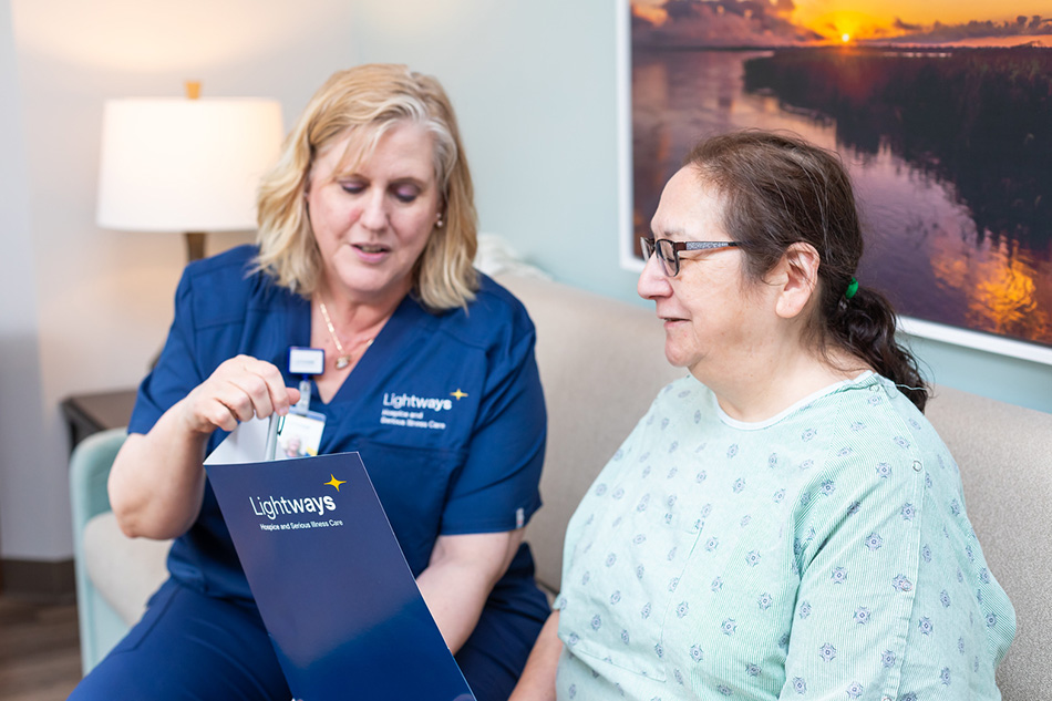 Lightways nurse reviewing a pamphlet with a patient