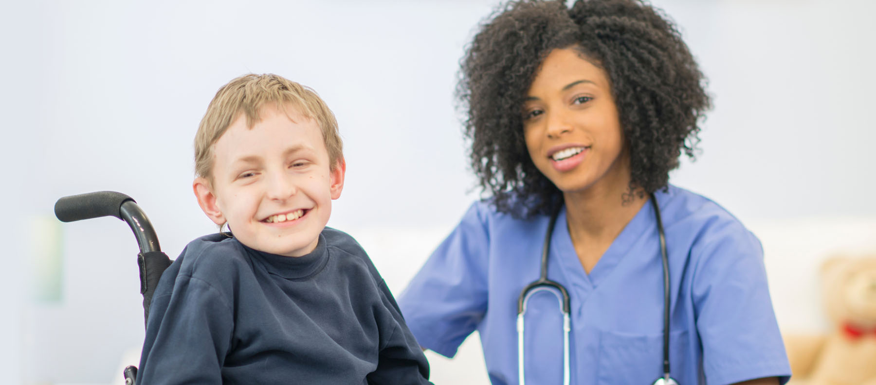 Nurse with child in wheelchair