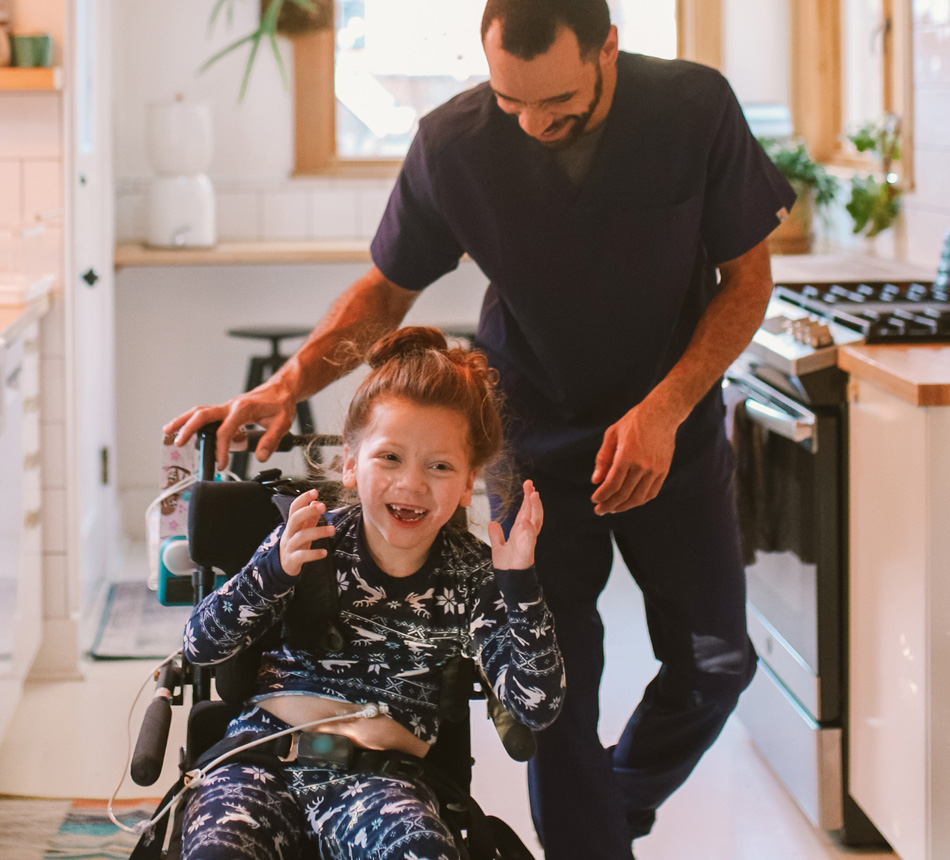 Dad playing with child in wheelchair