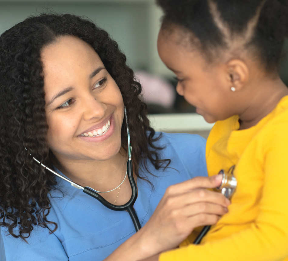 Nurse with child listening to heart