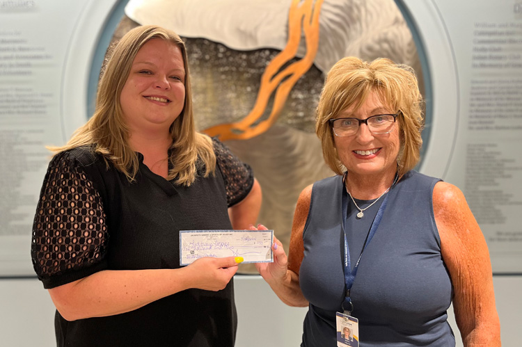 Friends of Hospice On the Rocks presents check to Lighways