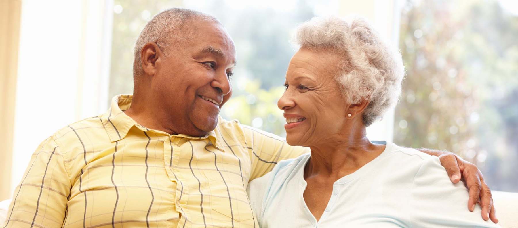 Black man and wife smiling at each other