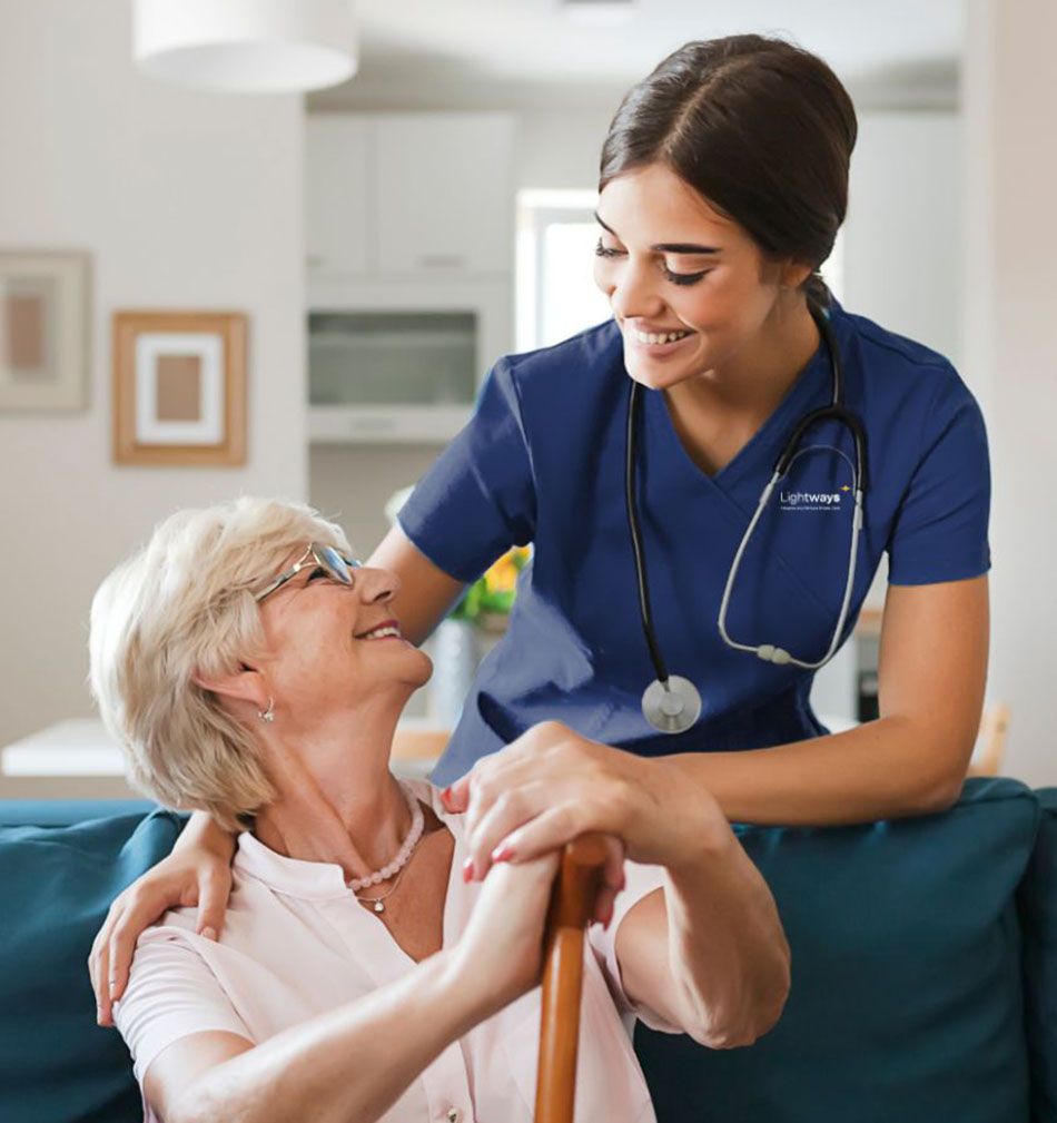 elderly women patient smiling at nurse