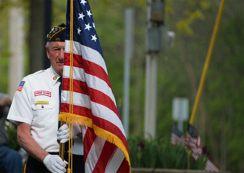 Veteran holding flag of United States of America