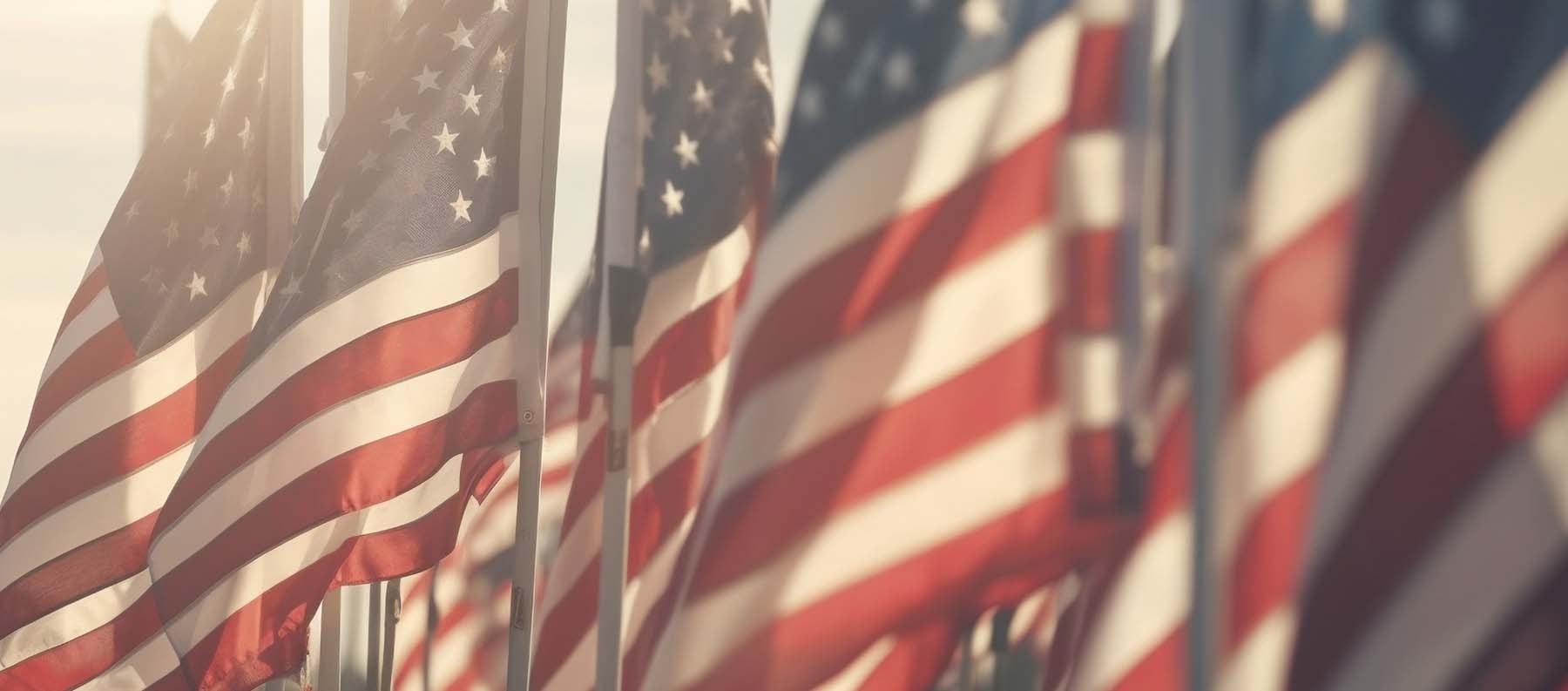 United States flags on display in a row.